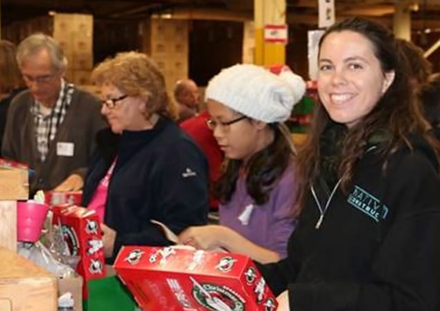 Skyline volunteers spent their work day packing boxes of toys