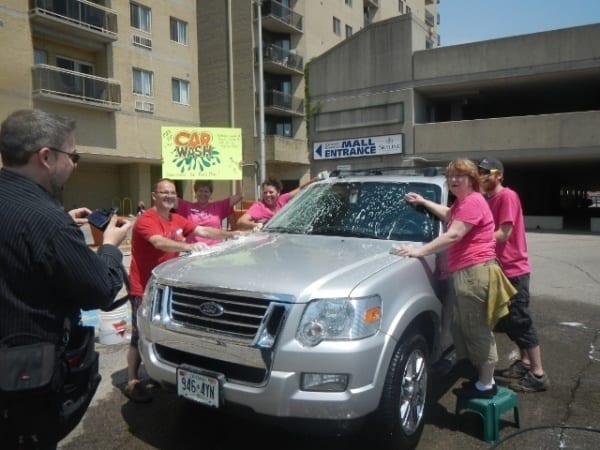 Residents washing a car to raise money for Fort McMurray victims