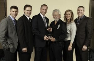Skyline owners and executives pose with David Suzuki after winning an environmental award