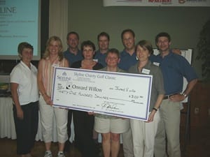 Skyline Co-Founders giving an oversized check to Onward Willow staff