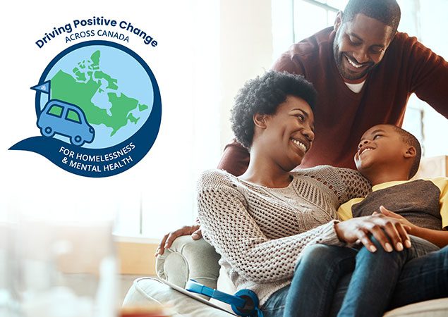 A mother, father, and son sitting together and smiling, with Driving Positive Change logo overlay.