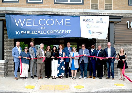 https://www.skylinegroupofcompanies.ca/wp-content/uploads/2024/06/GoC-SEMI-10-Shelldale-Ribbon-Cutting-Tablet.jpg